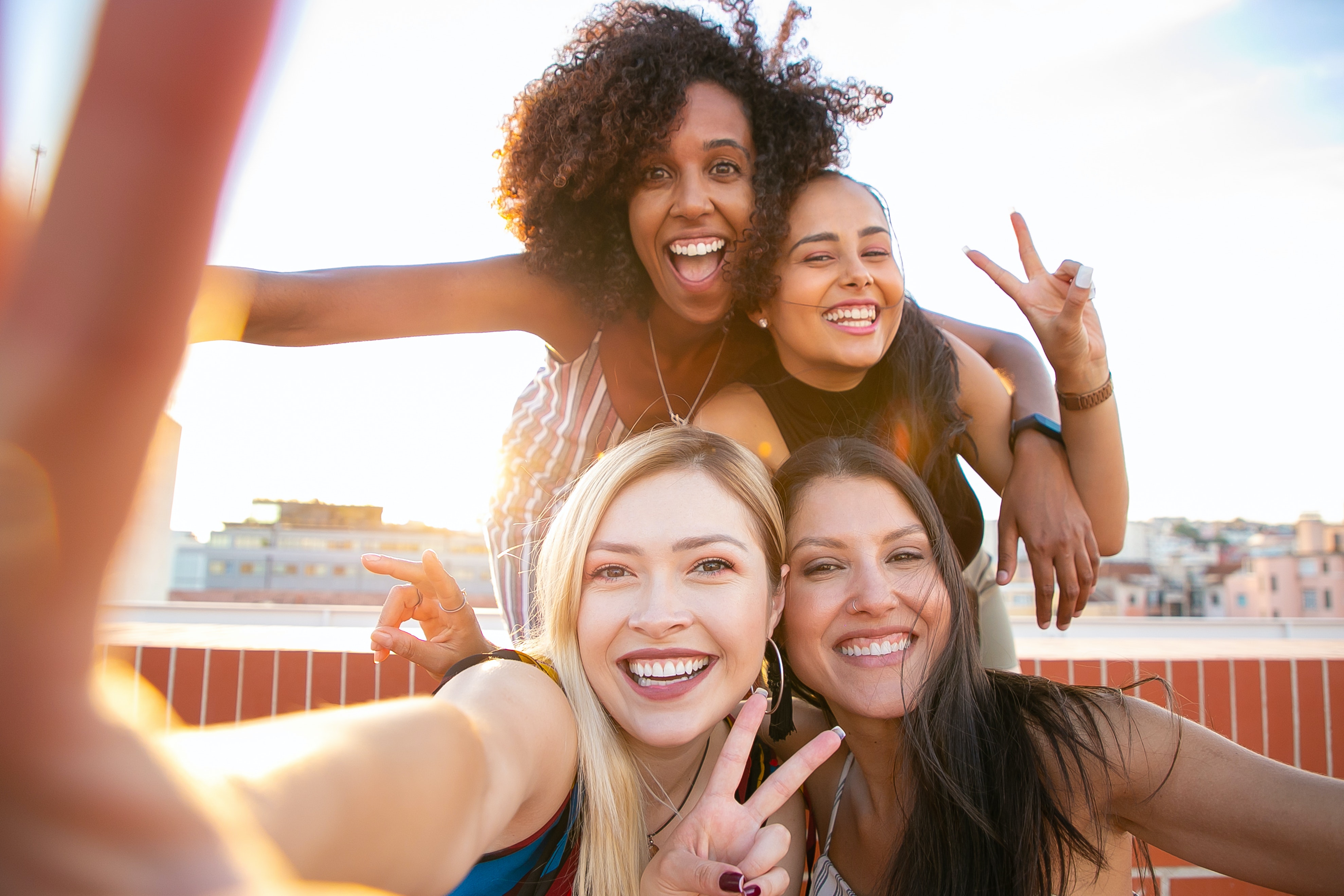 group of women excited taking selfies
